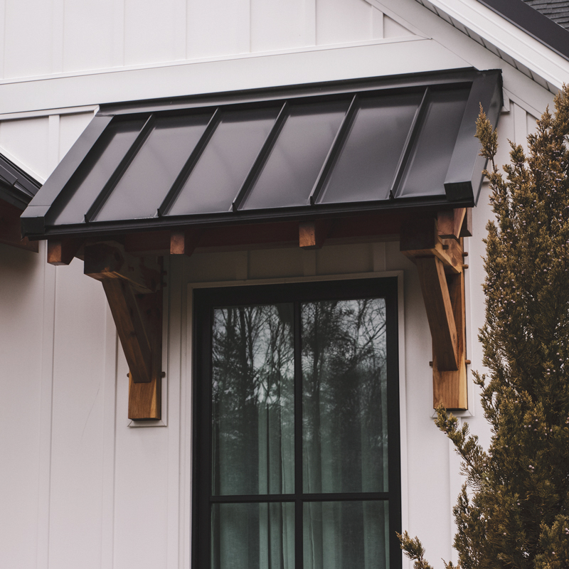 Stone shed with timber framed porch roof