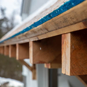 timber framed rafter tails on eyebrow roof