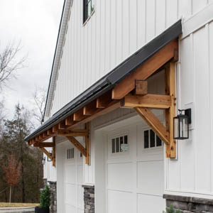 Timber framed roof over two garage doors