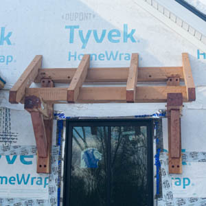 open rafters of the roof over a window